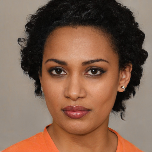 Neutral black young-adult female with medium  black hair and brown eyes