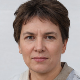 Joyful white adult female with short  brown hair and grey eyes