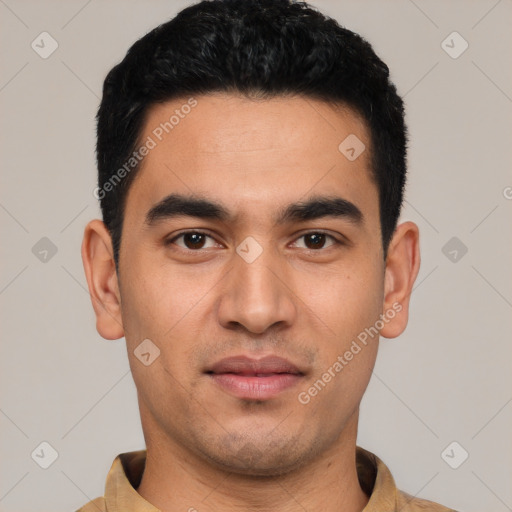 Joyful latino young-adult male with short  black hair and brown eyes