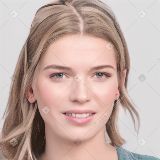 Joyful white young-adult female with medium  brown hair and blue eyes