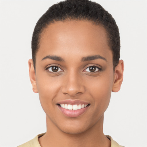 Joyful latino young-adult female with short  brown hair and brown eyes