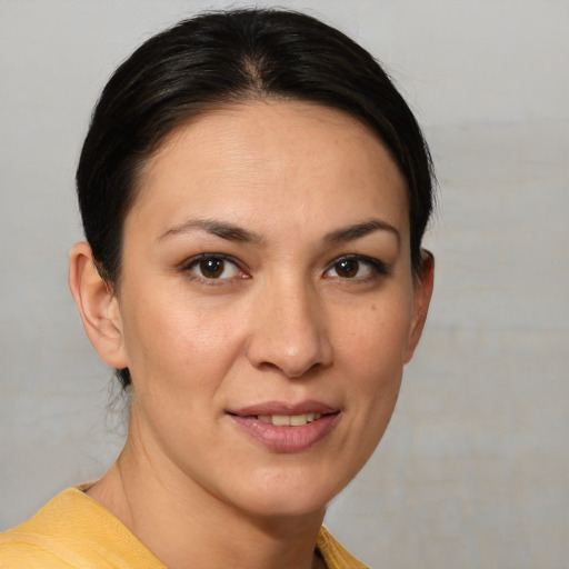 Joyful white young-adult female with medium  brown hair and brown eyes