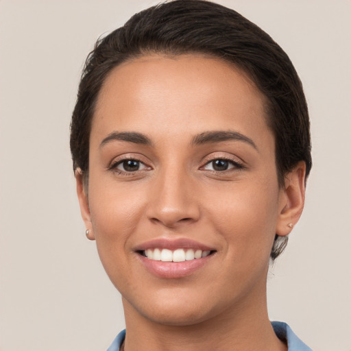 Joyful white young-adult female with short  brown hair and brown eyes