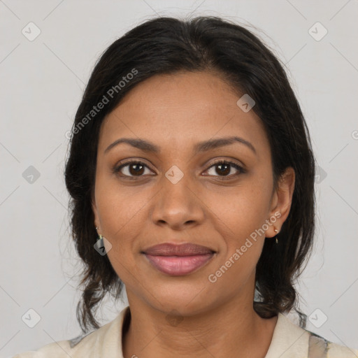 Joyful black young-adult female with medium  brown hair and brown eyes