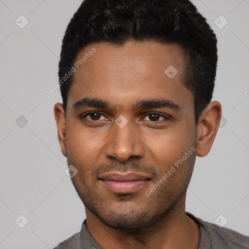 Joyful black young-adult male with short  black hair and brown eyes