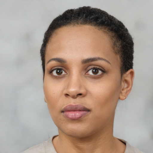 Neutral black young-adult female with short  black hair and brown eyes