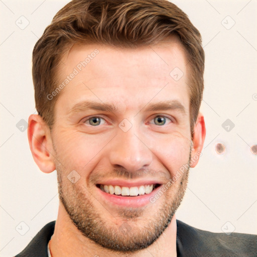 Joyful white young-adult male with short  brown hair and grey eyes