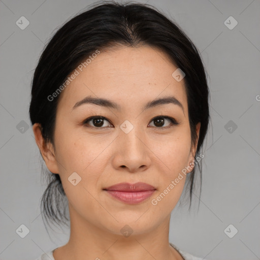 Joyful asian young-adult female with medium  black hair and brown eyes