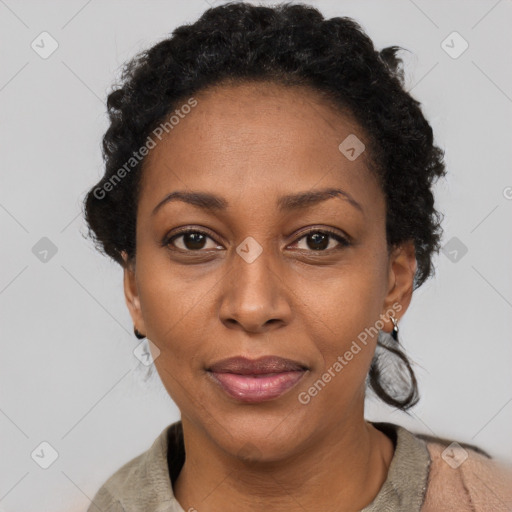 Joyful black adult female with short  black hair and brown eyes