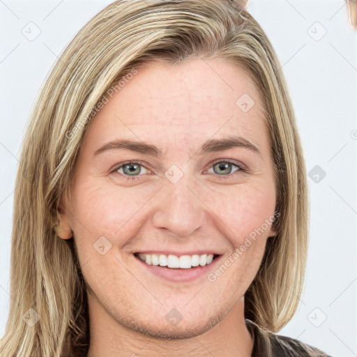 Joyful white young-adult female with long  brown hair and blue eyes