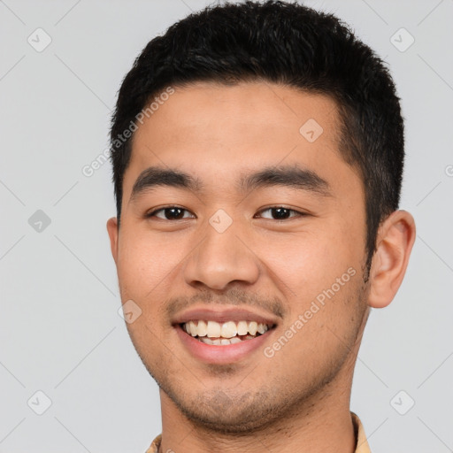 Joyful latino young-adult male with short  black hair and brown eyes