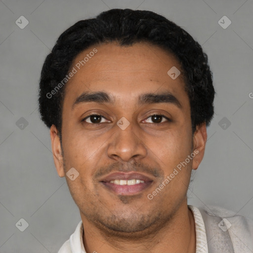 Joyful latino young-adult male with short  black hair and brown eyes