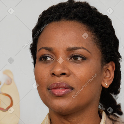 Joyful black young-adult female with medium  black hair and brown eyes