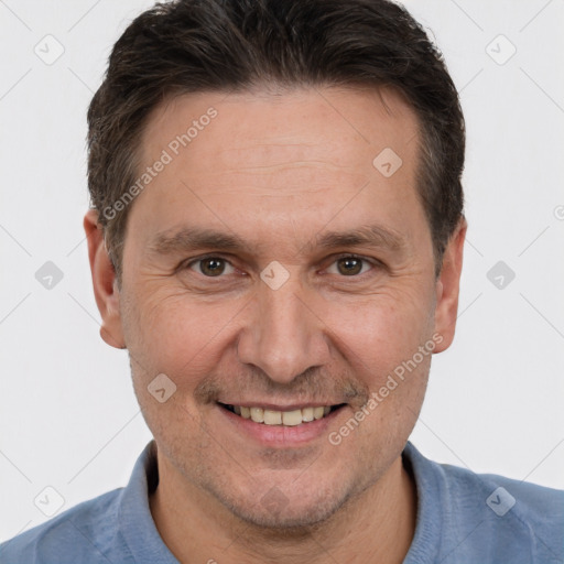 Joyful white adult male with short  brown hair and brown eyes