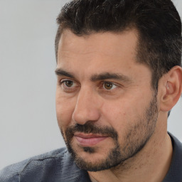 Neutral white adult male with short  black hair and brown eyes