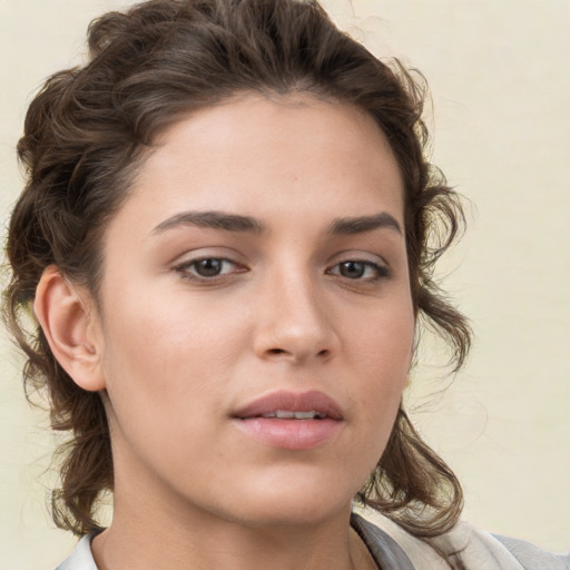 Neutral white young-adult female with medium  brown hair and brown eyes