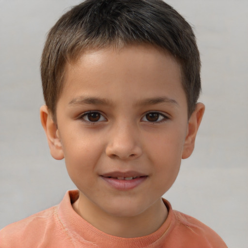 Joyful white child male with short  brown hair and brown eyes