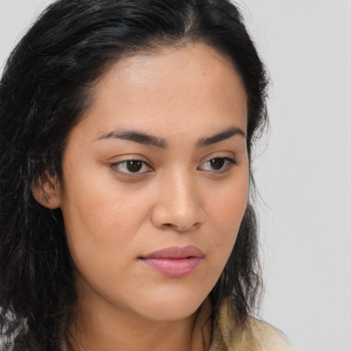 Joyful asian young-adult female with long  brown hair and brown eyes