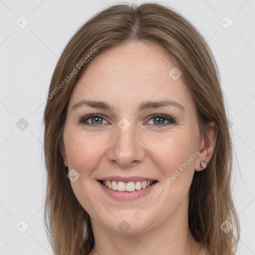 Joyful white young-adult female with long  brown hair and grey eyes