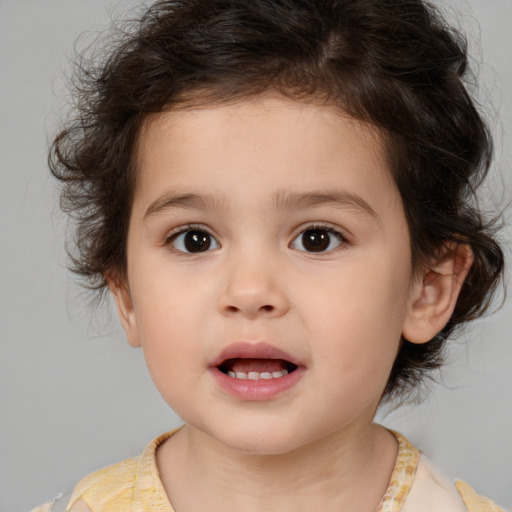 Joyful white child female with medium  brown hair and brown eyes