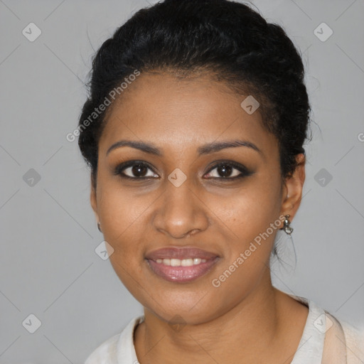 Joyful black young-adult female with short  black hair and brown eyes