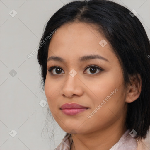 Joyful asian young-adult female with medium  black hair and brown eyes