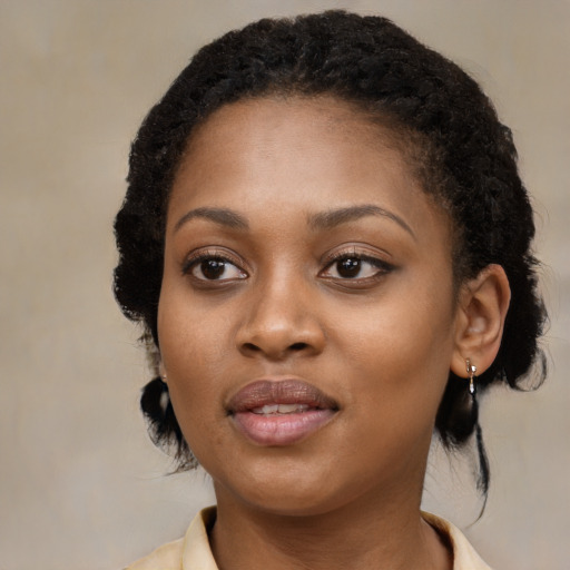 Joyful black young-adult female with medium  black hair and brown eyes