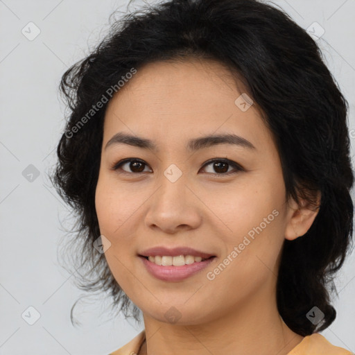 Joyful latino young-adult female with medium  brown hair and brown eyes