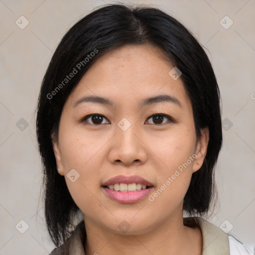 Joyful asian young-adult female with medium  black hair and brown eyes