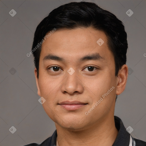 Joyful latino young-adult male with short  black hair and brown eyes