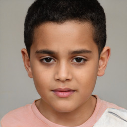 Joyful white child male with short  brown hair and brown eyes