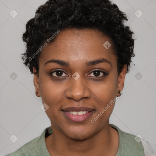 Joyful black young-adult female with short  brown hair and brown eyes