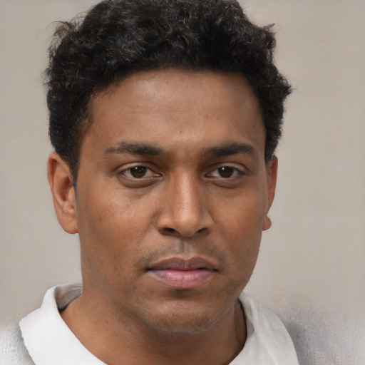 Neutral latino young-adult male with short  brown hair and brown eyes