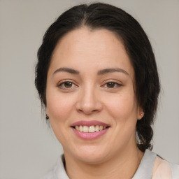 Joyful white adult female with medium  brown hair and brown eyes