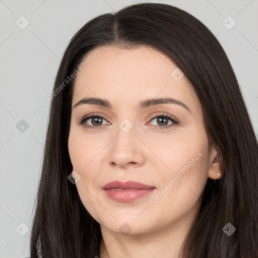 Joyful white young-adult female with long  black hair and brown eyes