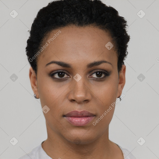 Joyful black young-adult female with short  black hair and brown eyes