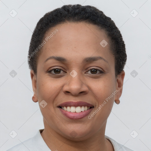 Joyful latino young-adult female with short  brown hair and brown eyes