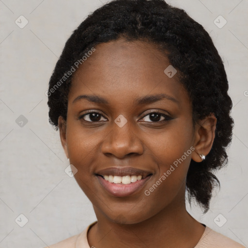 Joyful black young-adult female with medium  black hair and brown eyes