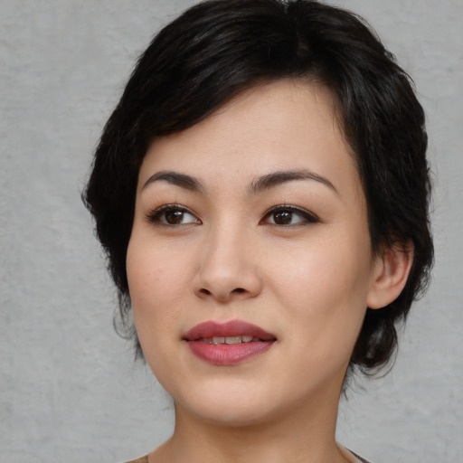 Joyful white young-adult female with medium  black hair and brown eyes