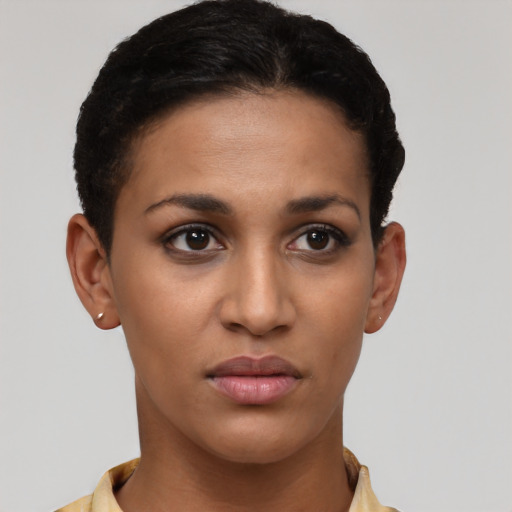 Joyful latino young-adult female with short  brown hair and brown eyes