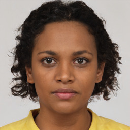 Neutral black young-adult female with short  brown hair and brown eyes