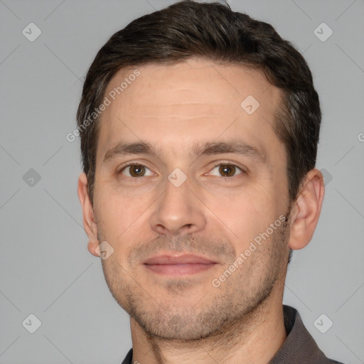 Joyful white adult male with short  brown hair and brown eyes