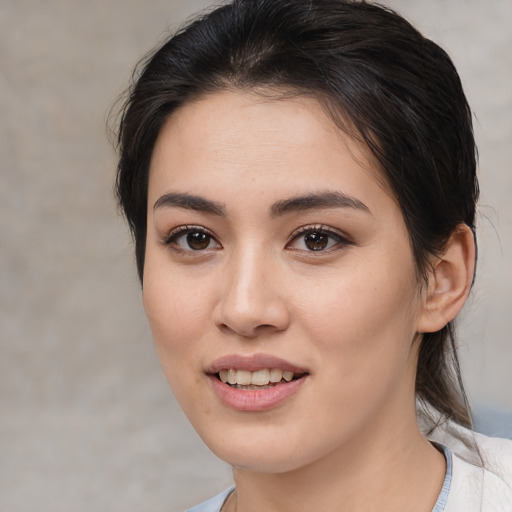 Joyful white young-adult female with medium  brown hair and brown eyes