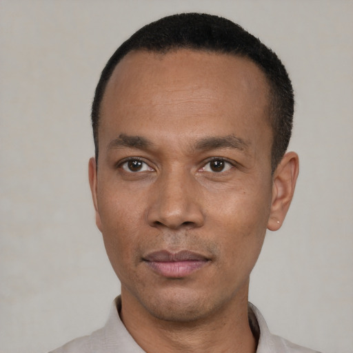 Neutral latino adult male with short  black hair and brown eyes