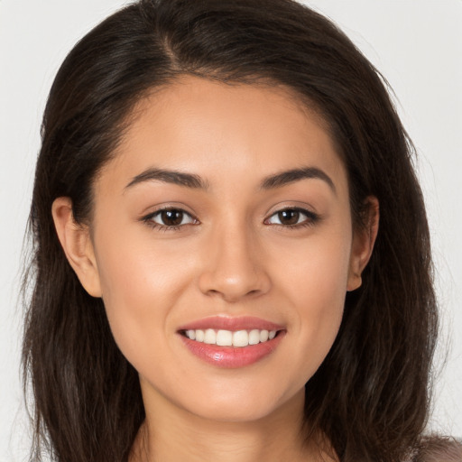 Joyful white young-adult female with long  brown hair and brown eyes