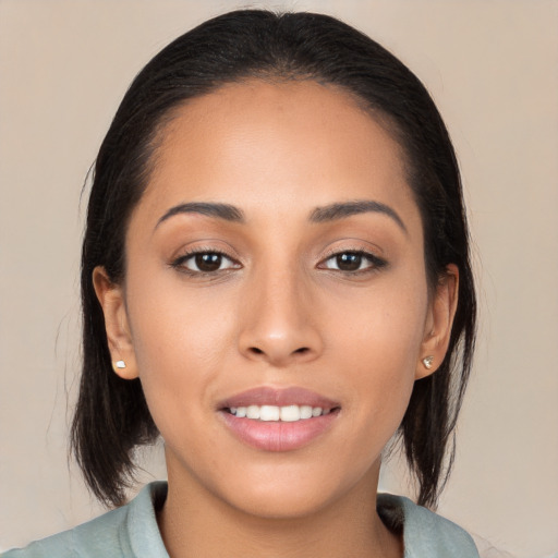 Joyful asian young-adult female with medium  brown hair and brown eyes