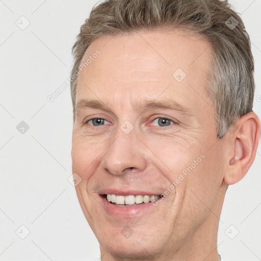 Joyful white adult male with short  brown hair and grey eyes