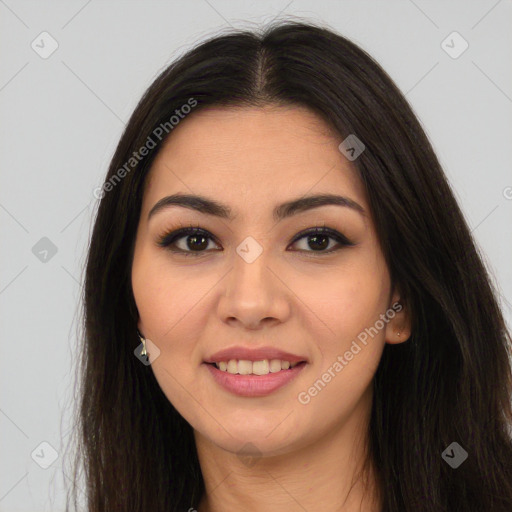 Joyful latino young-adult female with long  brown hair and brown eyes