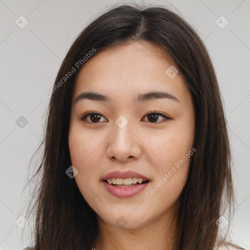 Joyful asian young-adult female with long  brown hair and brown eyes