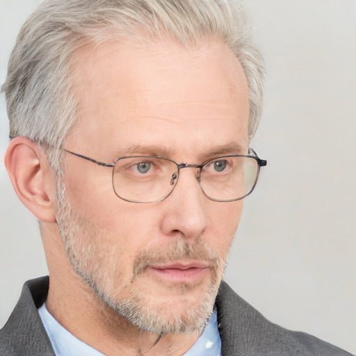 Neutral white middle-aged male with short  gray hair and blue eyes